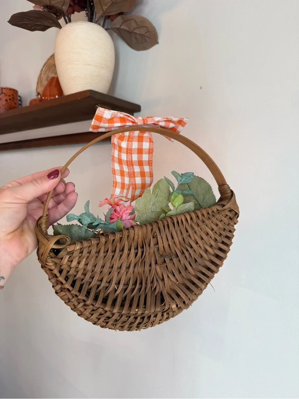 Woven Brown Hanging Basket with Orange Gingham Bow and Faux Floral Accents